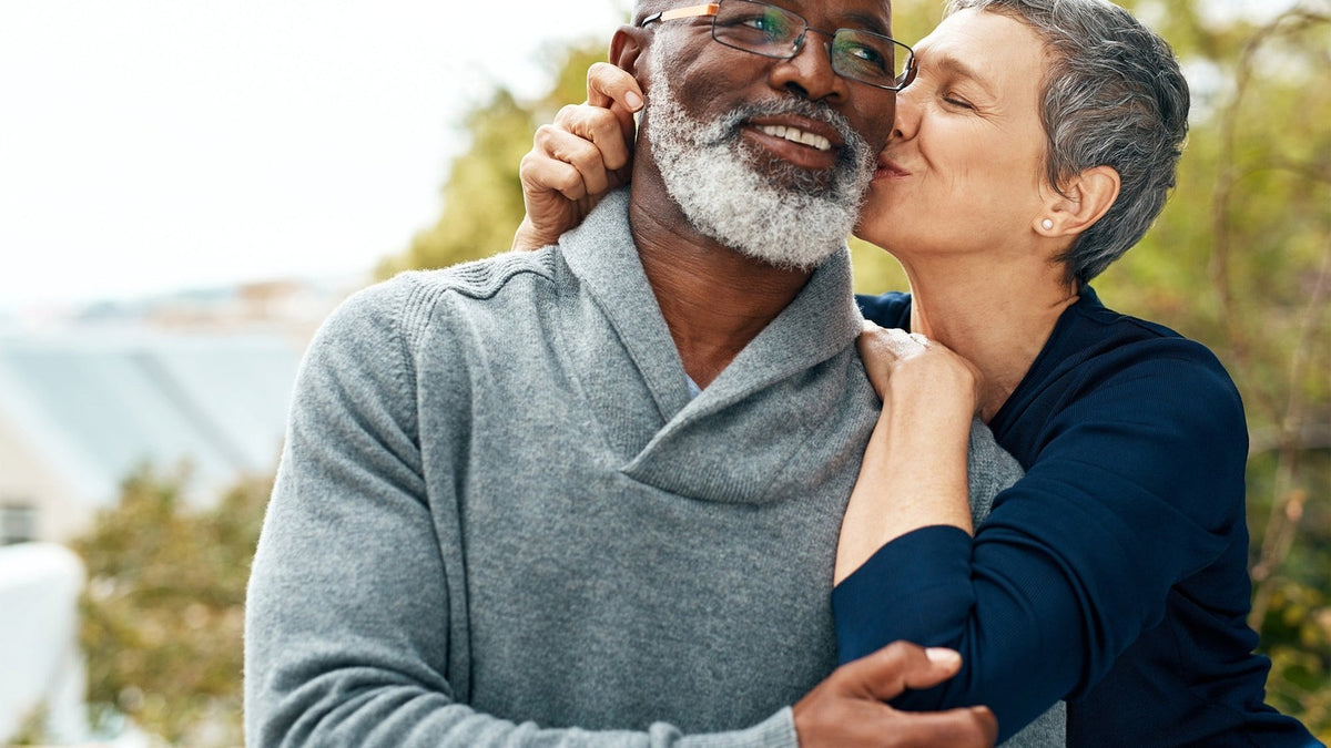 Older couple embracing outdoors, the everyday heart-health routine behind nattokinase benefits